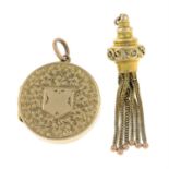 A tassle charm and a locket pendant.