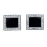 A pair of onyx and pavè-set diamond cufflinks.