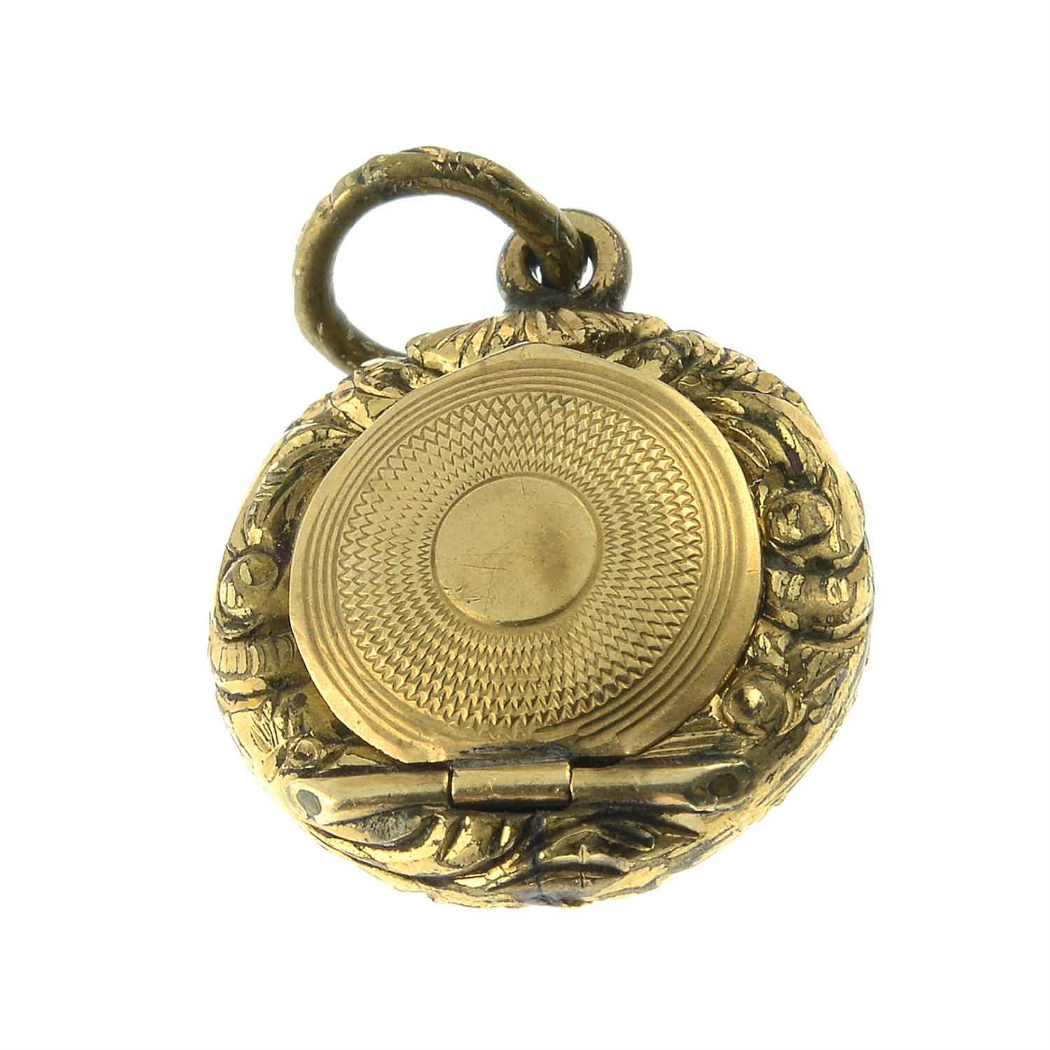A mid 19th century scroll embossed locket. - Image 2 of 2