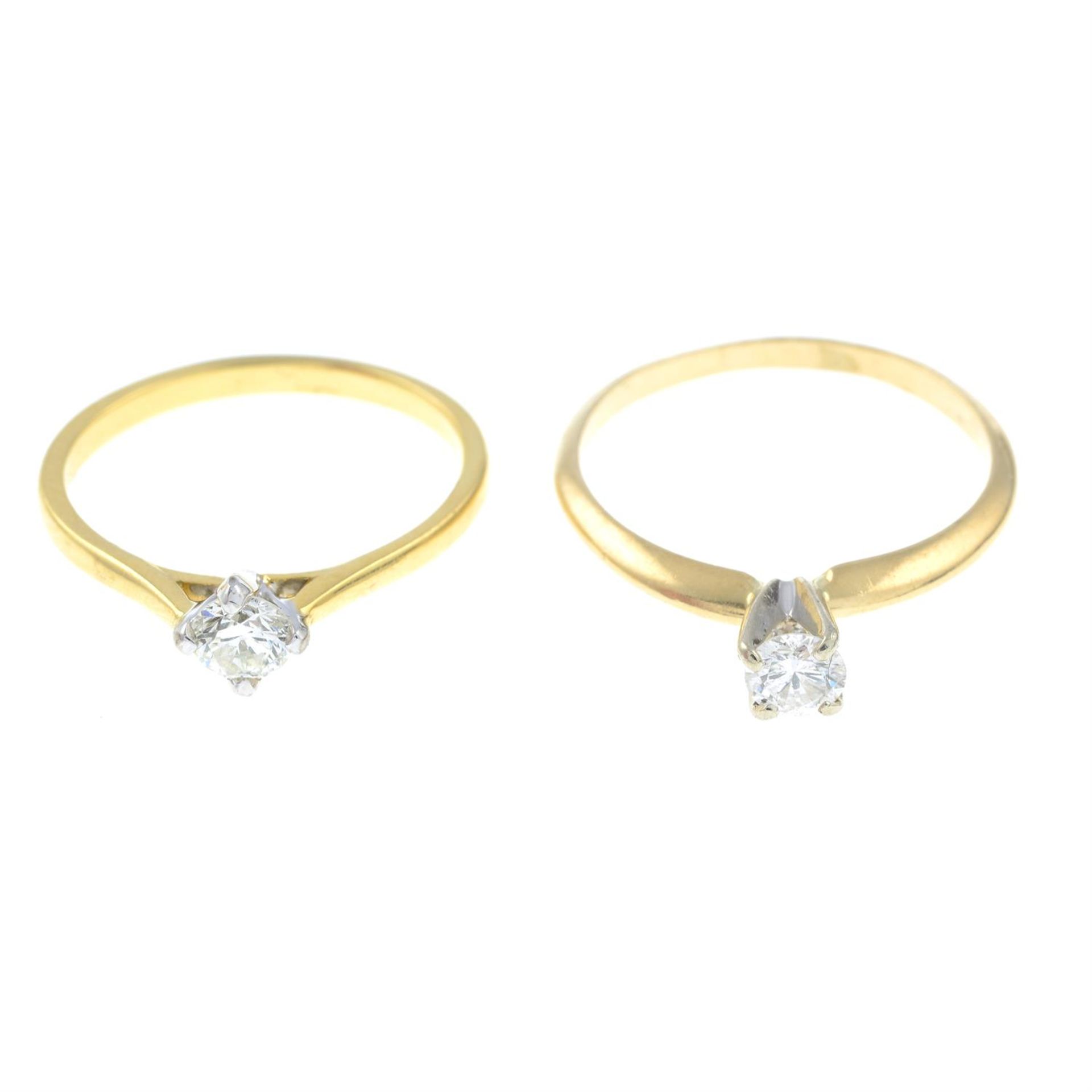 Two brilliant-cut diamond single-stone rings.