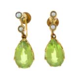A pair of early 20th century 9ct gold peridot and split pearl earrings.