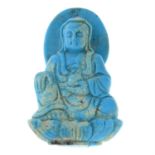 A turquoise pendant, depicting Buddha.