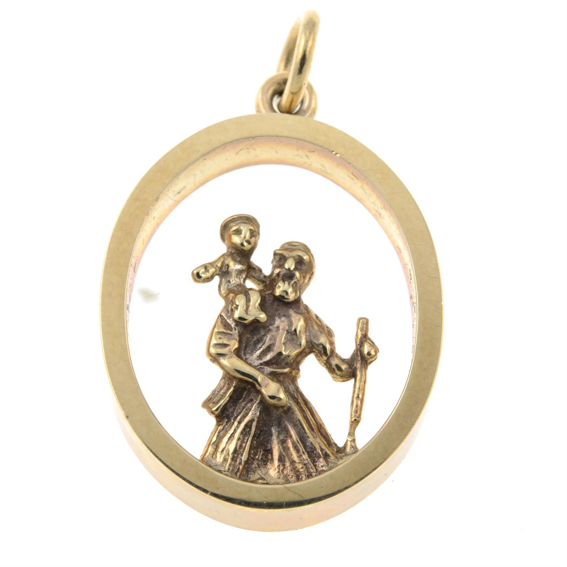 A St. Christopher open work pendant.