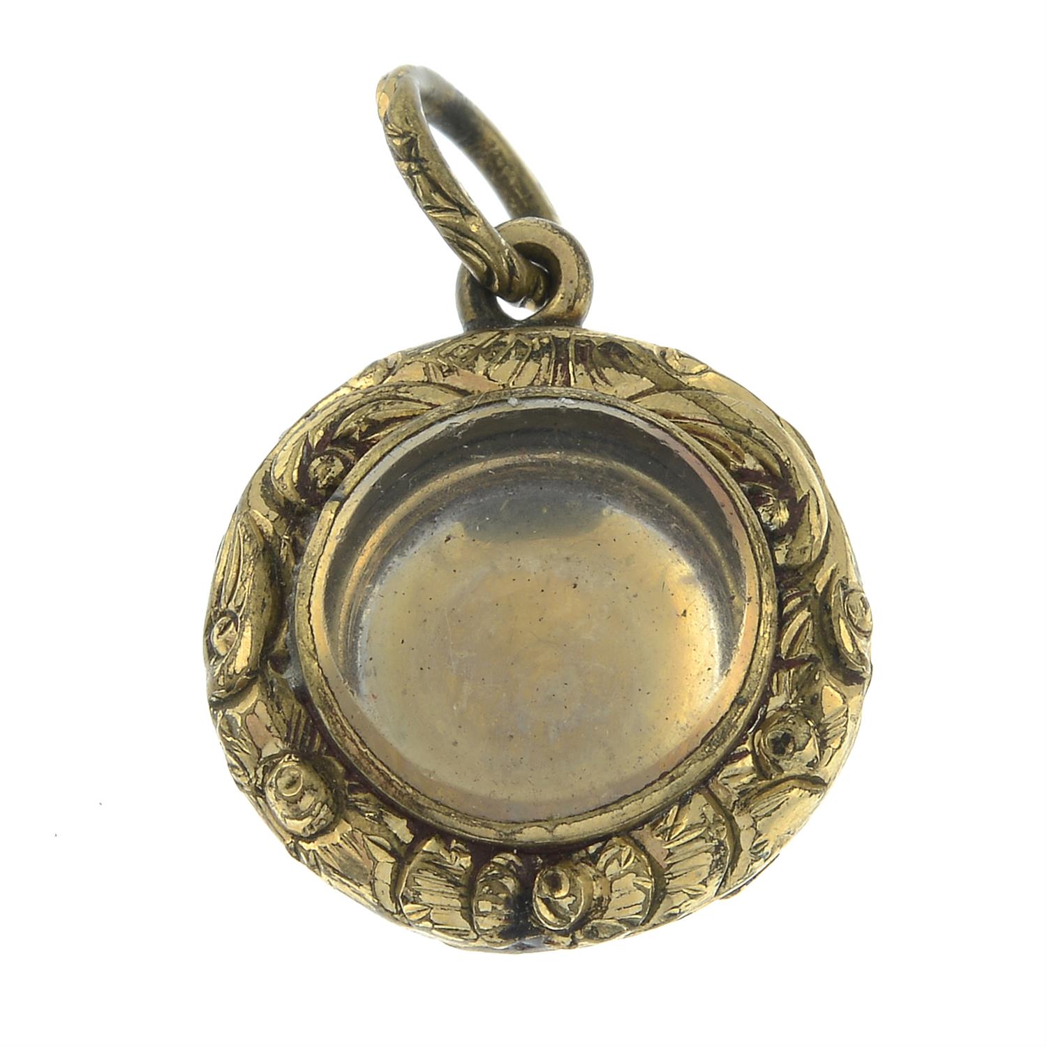 A mid 19th century scroll embossed locket.