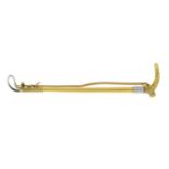 An early 20th century 15ct gold riding crop brooch.