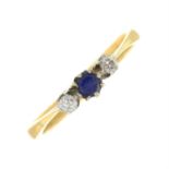 A sapphire and diamond three-stone ring.