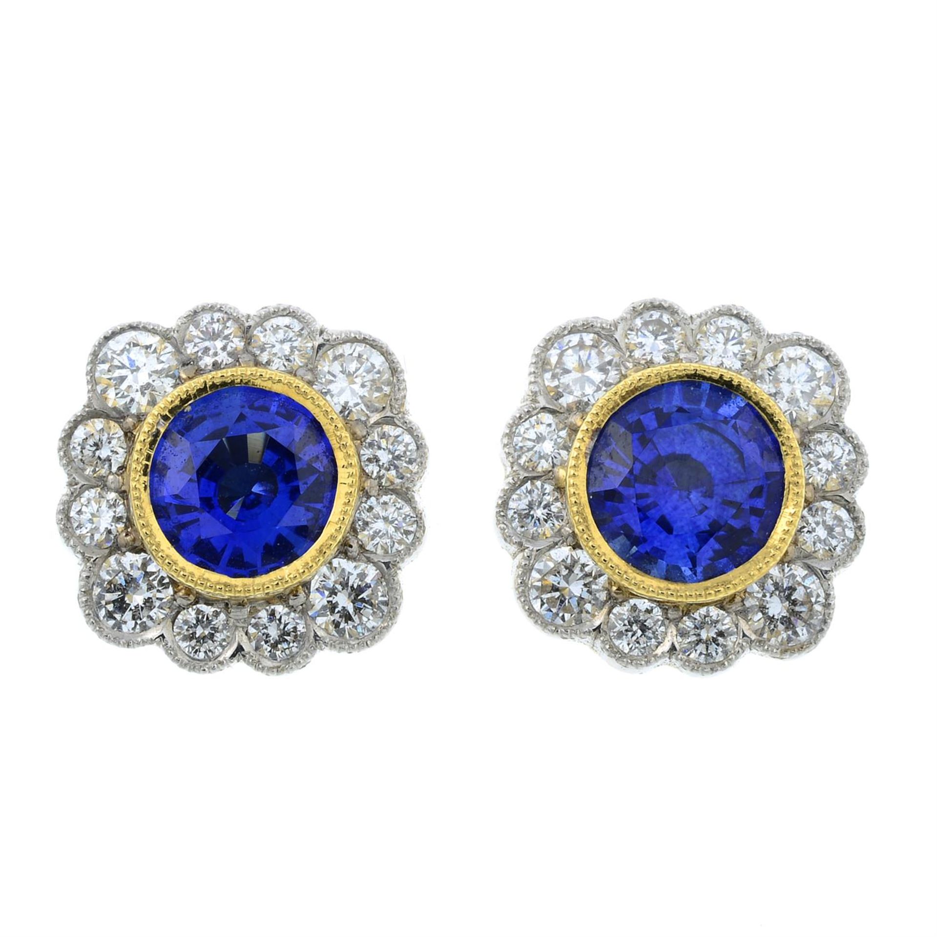 A pair of 18ct gold sapphire and diamond cluster earrings.