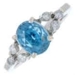 A blue zircon and diamond dress ring.