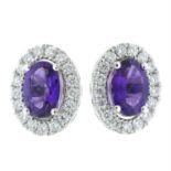 A pair of 18ct gold amethyst and diamond stud earrings.