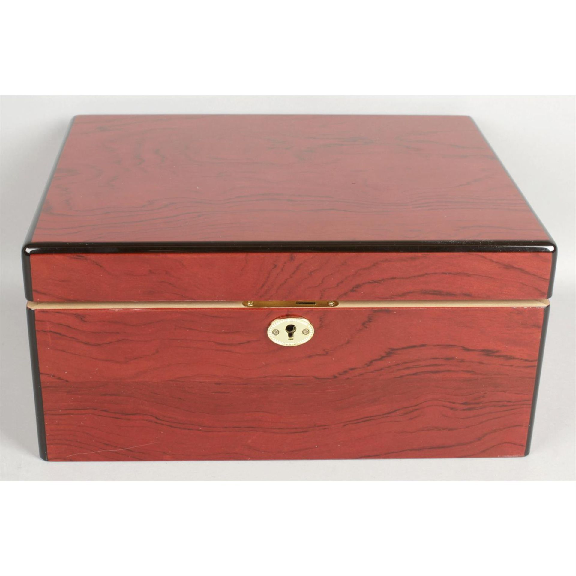 An unusual red stained wooden Cuban humidor.