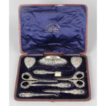 A late Victorian silver mounted manicure set in fitted case, together with a silver compact & vesta