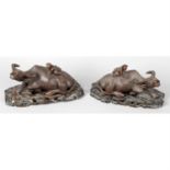 A pair of early 20th century Chinese carved hardwood studies of water buffalo.