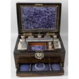 A Victorian coromandal ladies travelling dressing table box.