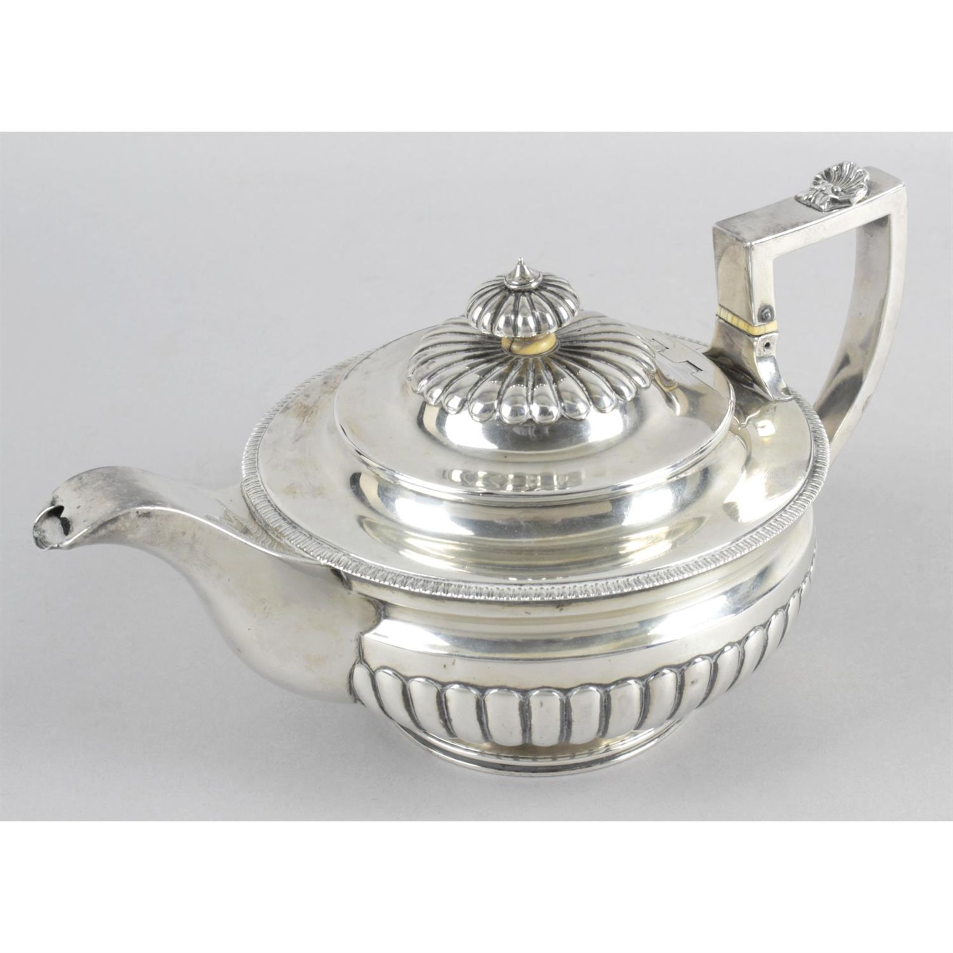 A late George III silver teapot.