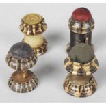 Three 19th Century Tunbridge ware pin cushions, together with a similar example with fitted tape