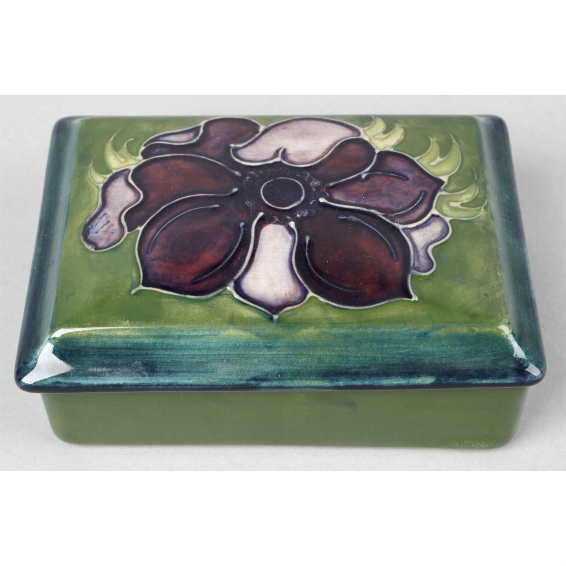 A Moorcroft pottery trinket box.