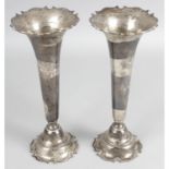 A pair of early 20th century silver vases.