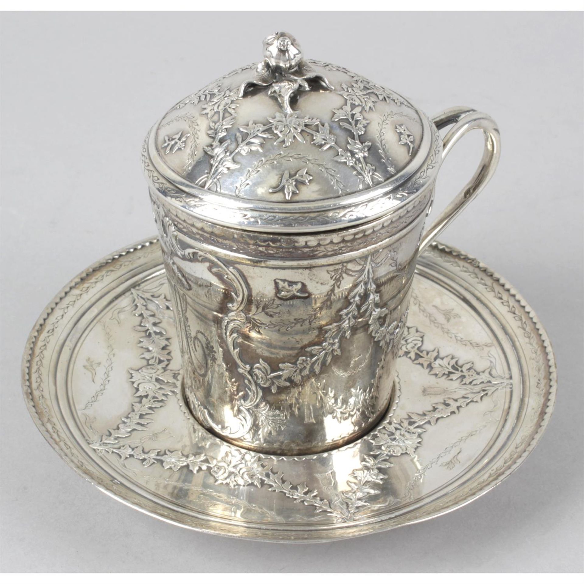 A French silver chocolate cup and saucer.