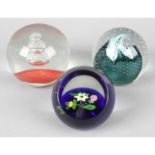 13 assorted glass paperweights