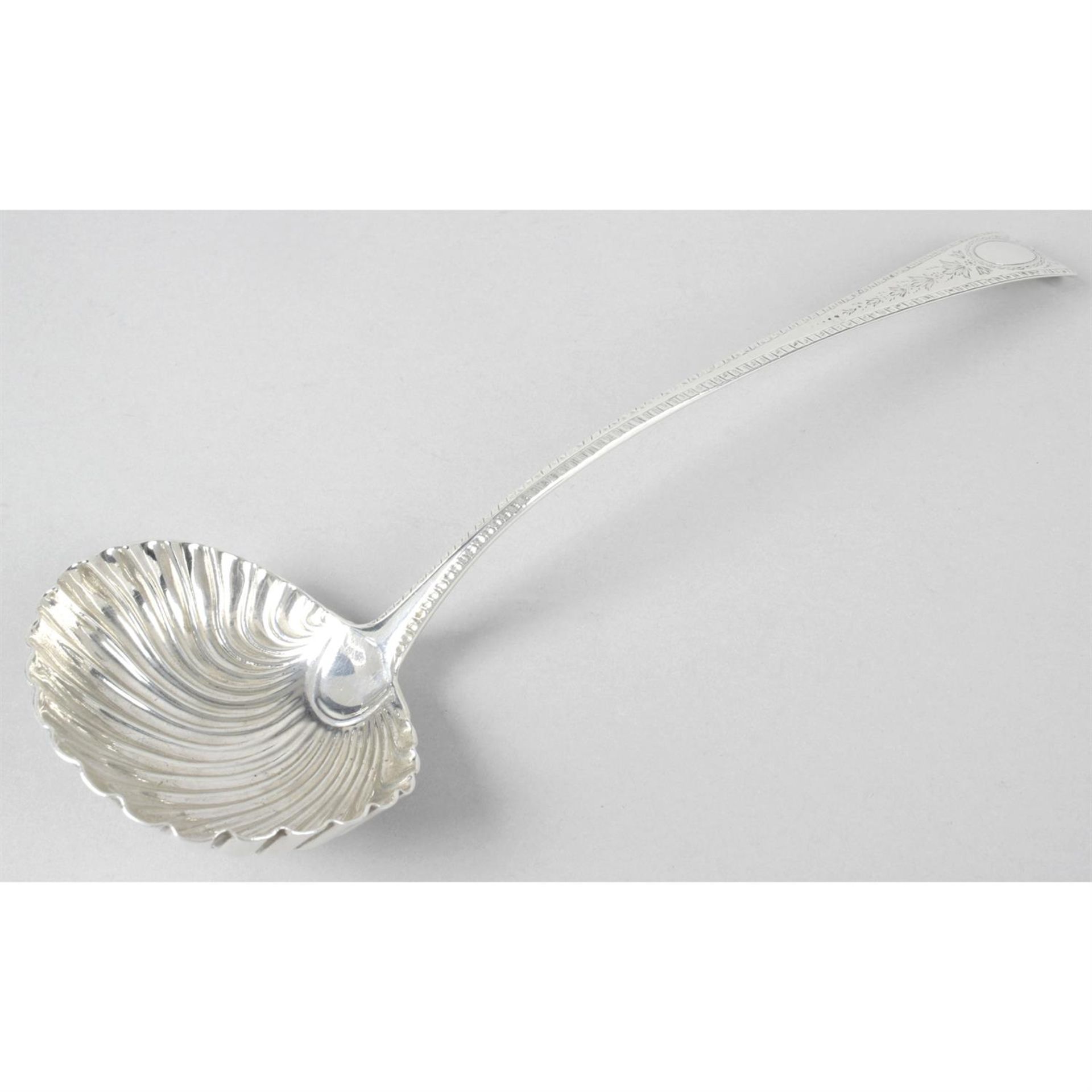 A George III silver soup ladle with shell bowl.