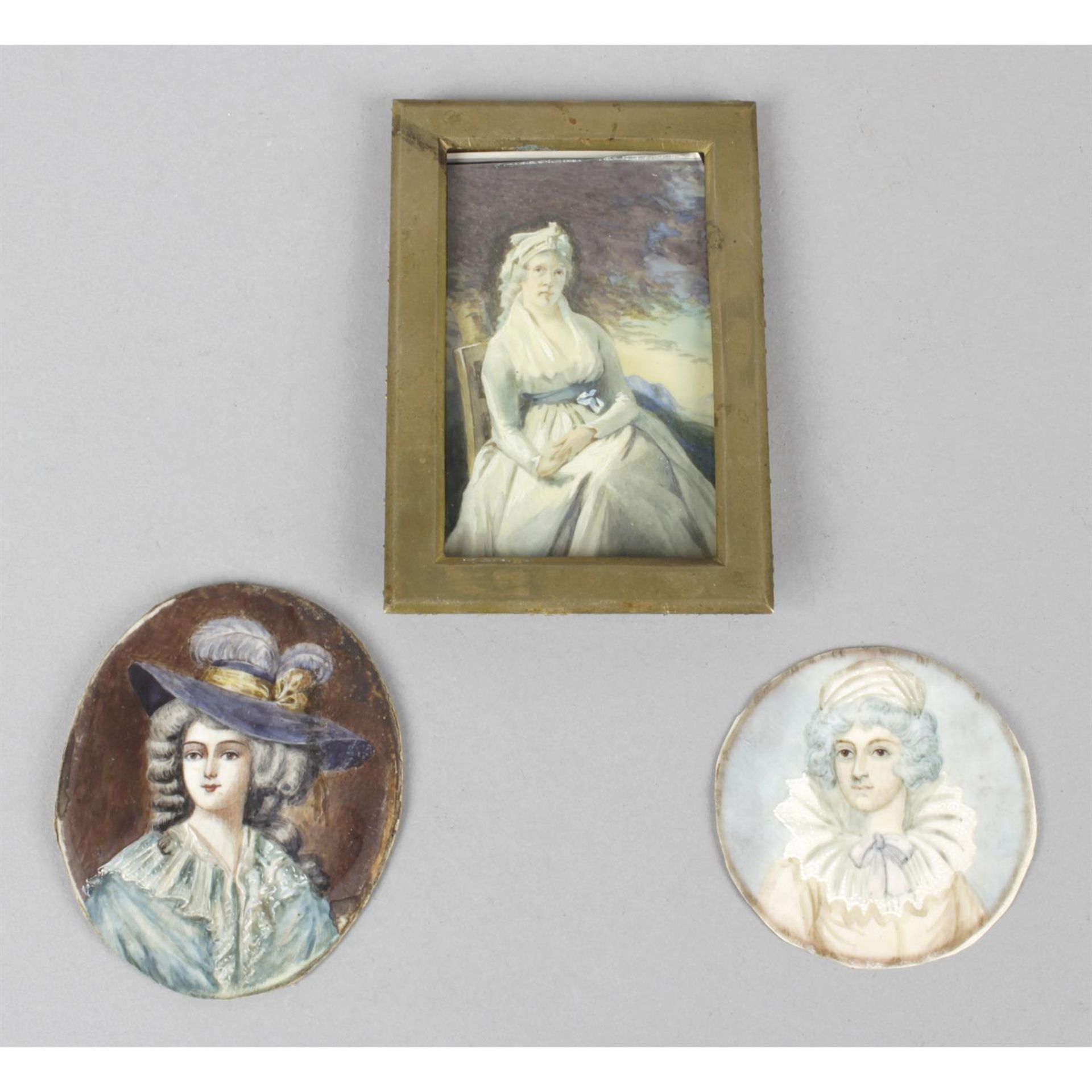 Three painted portrait miniatures.