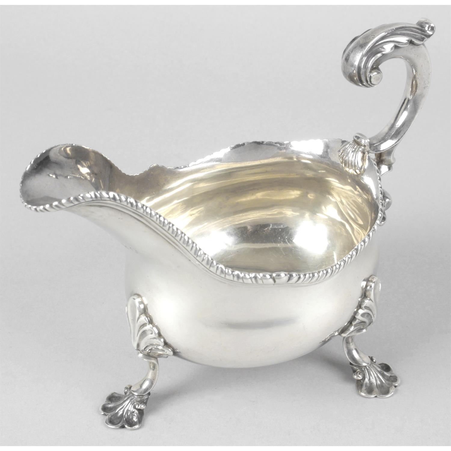 A George III silver sauce boat by Peter & Ann Bateman.