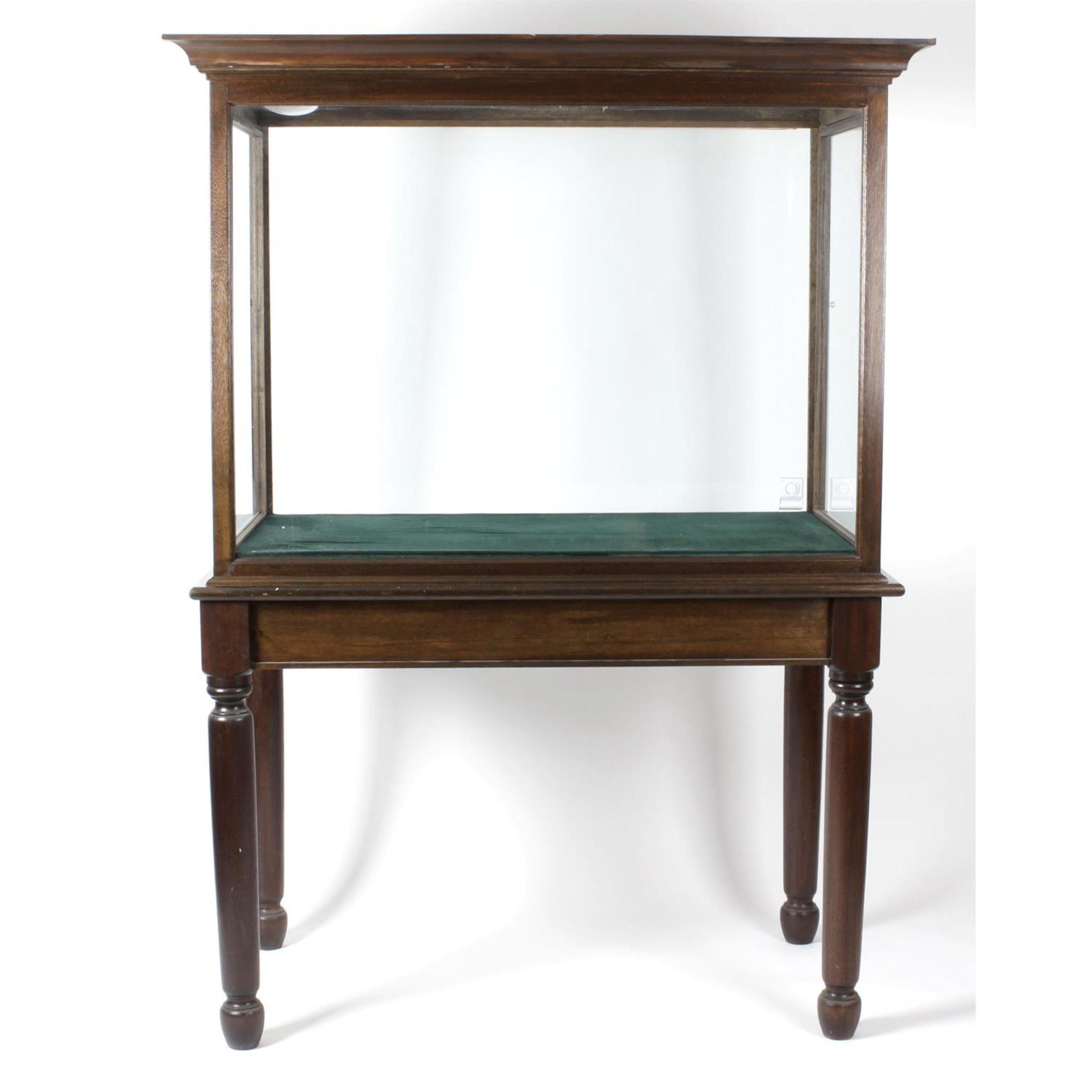 A large reproduction mahogany display cabinet.