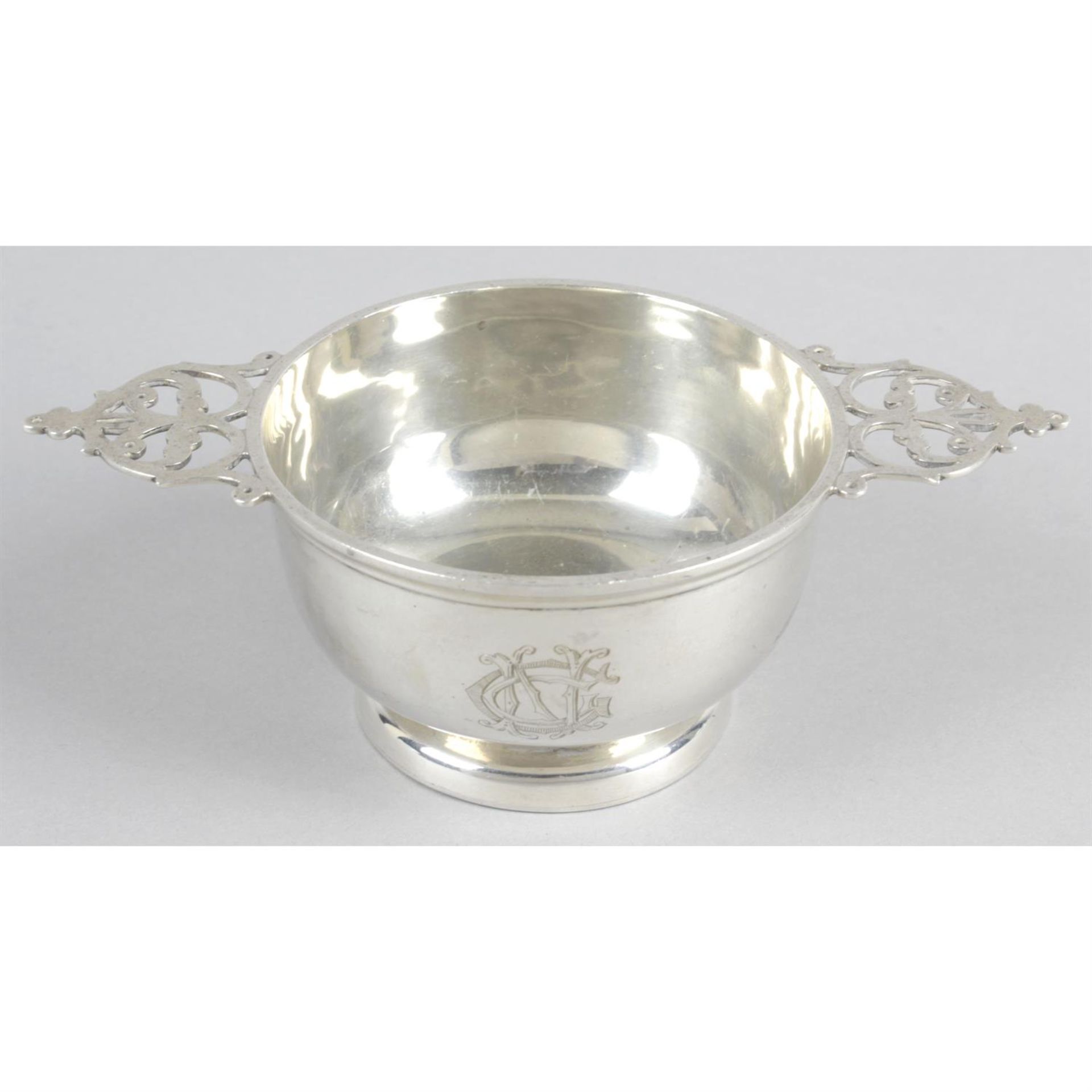 A late Victorian silver quaich style bowl with pierced handles.