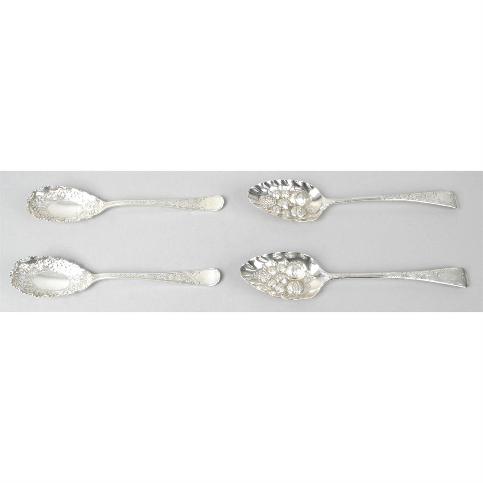 A pair of George IV silver 'berry' table spoons, together with a pair of late Victorian silver
