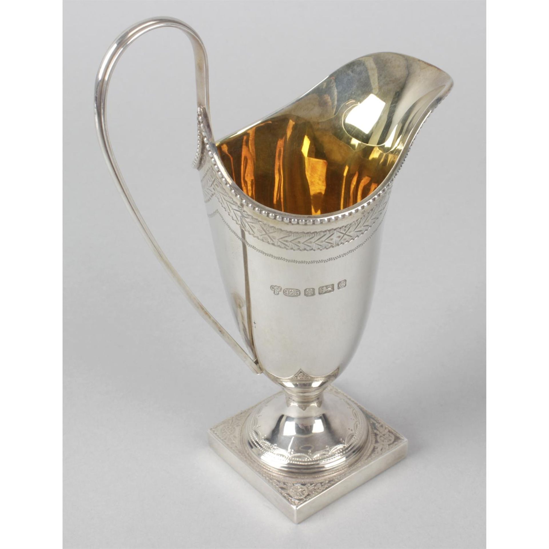 A modern silver reproduction cream jug in George III style. - Image 2 of 3