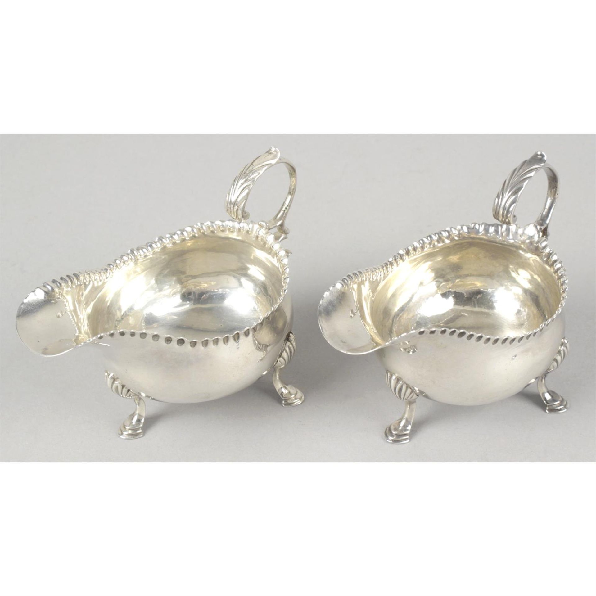 A pair of George III small silver sauce boats by Hester Bateman.