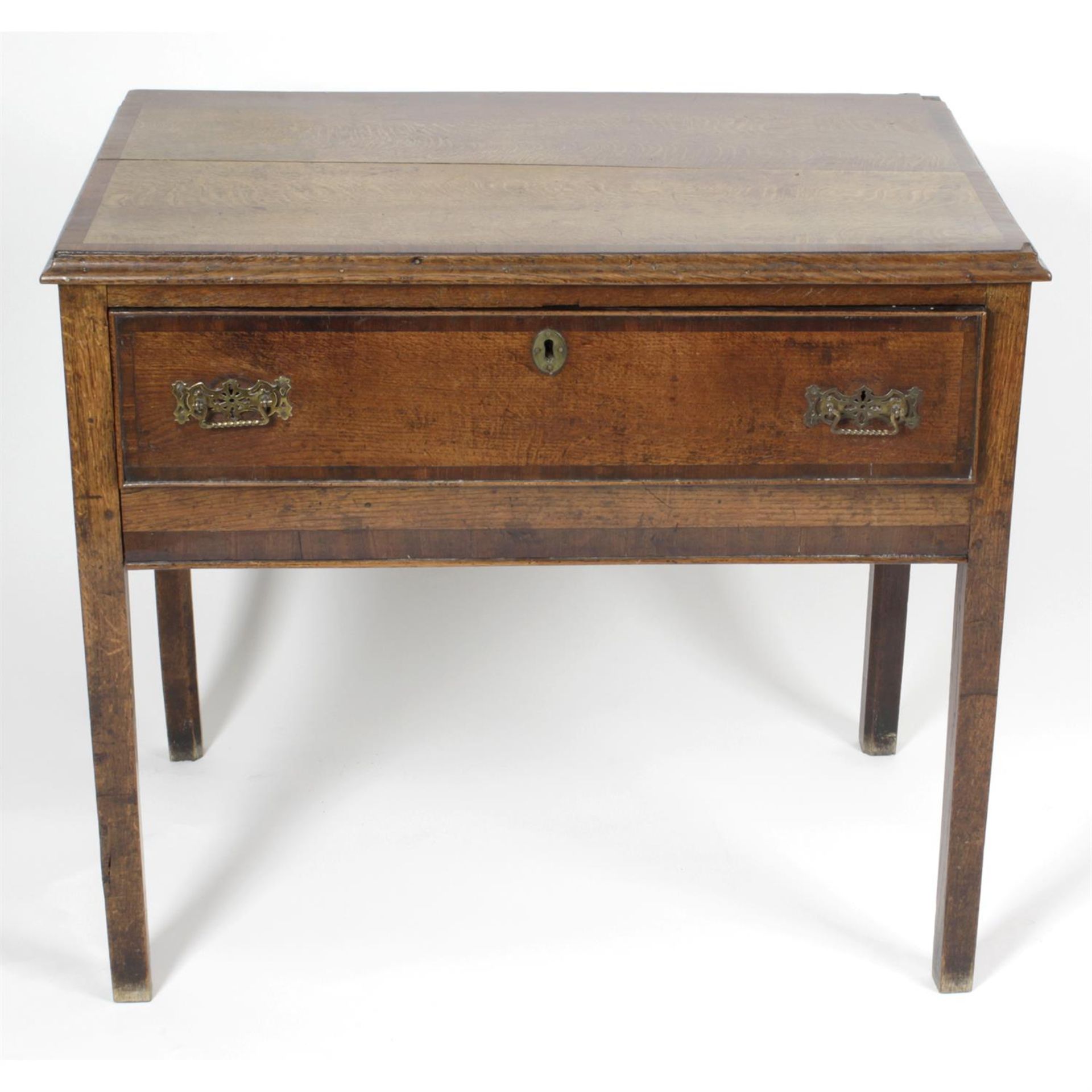 A 19th century oak and mahogany cross-banded side table.