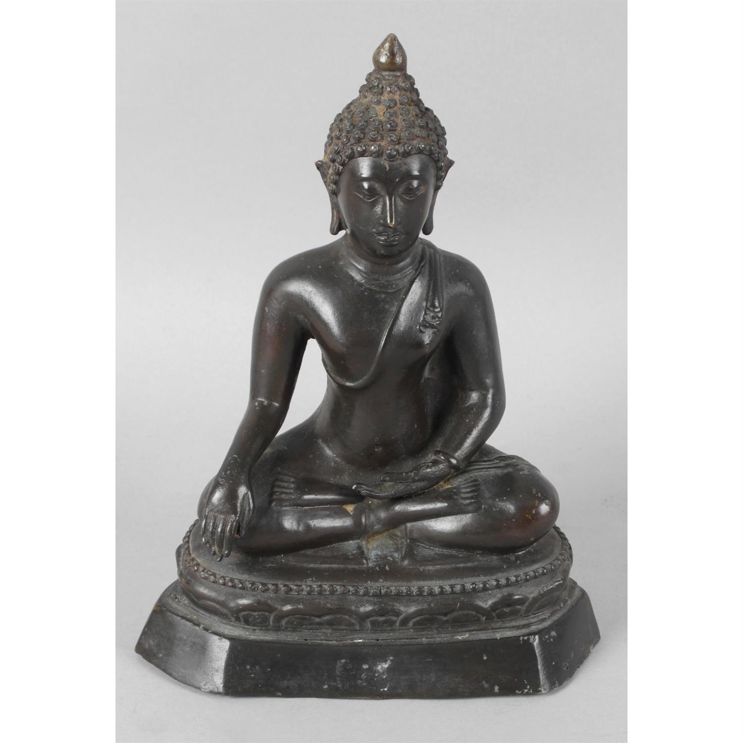 A bronze Eastern Buddha.