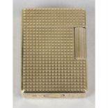 An S. T Dupont gold plated cigarette lighter