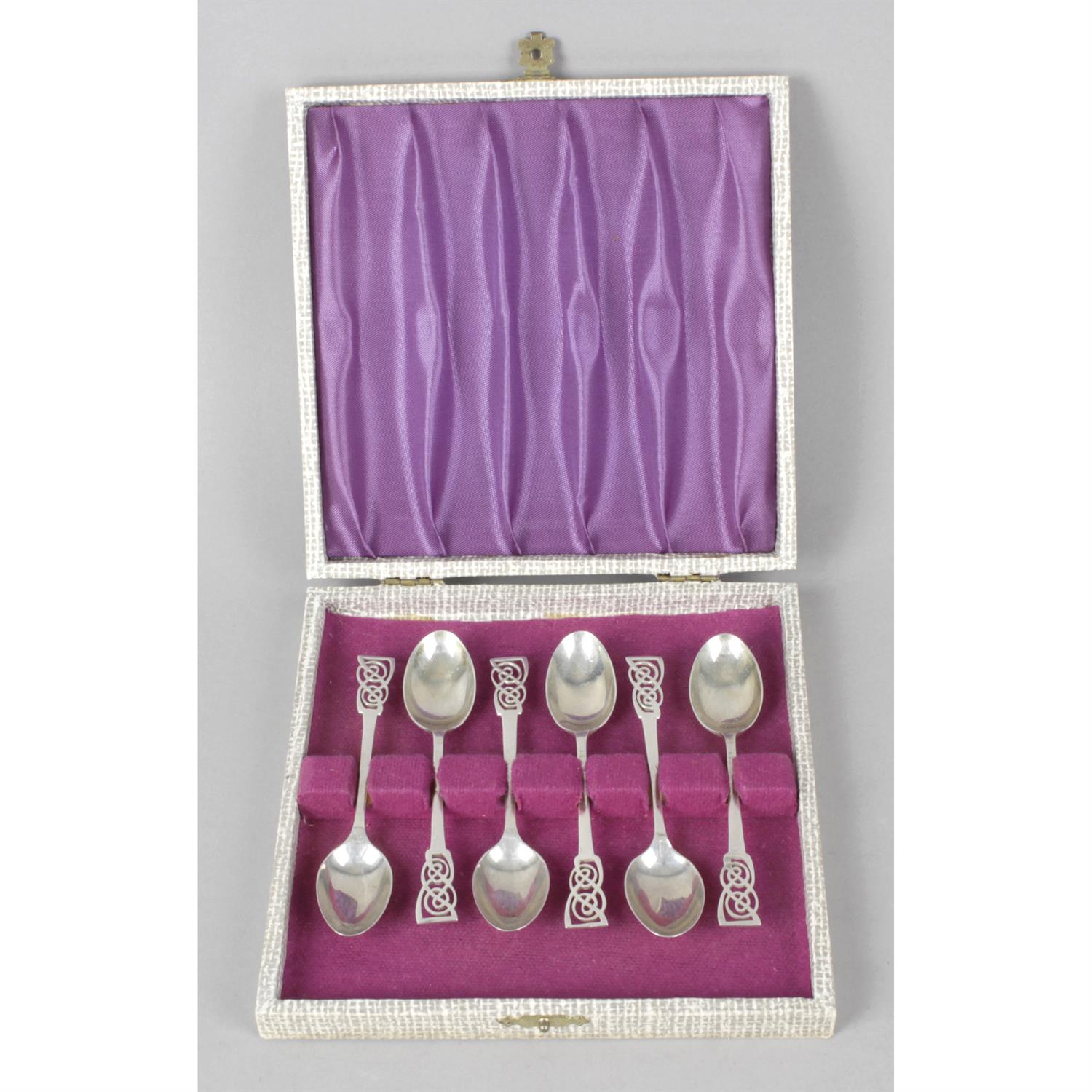 Two cased sets of mid-20th silver coffee spoons.