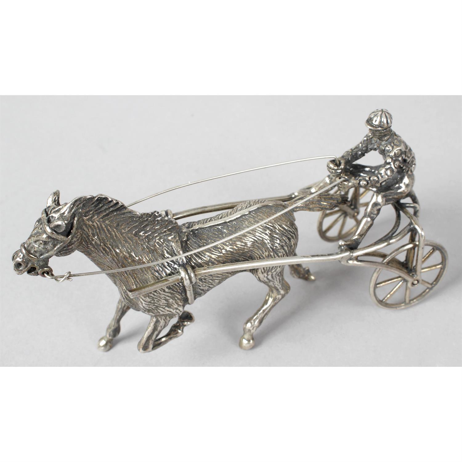 A modern Italian silver figure of a sulky, together with another modelled as a workbench,