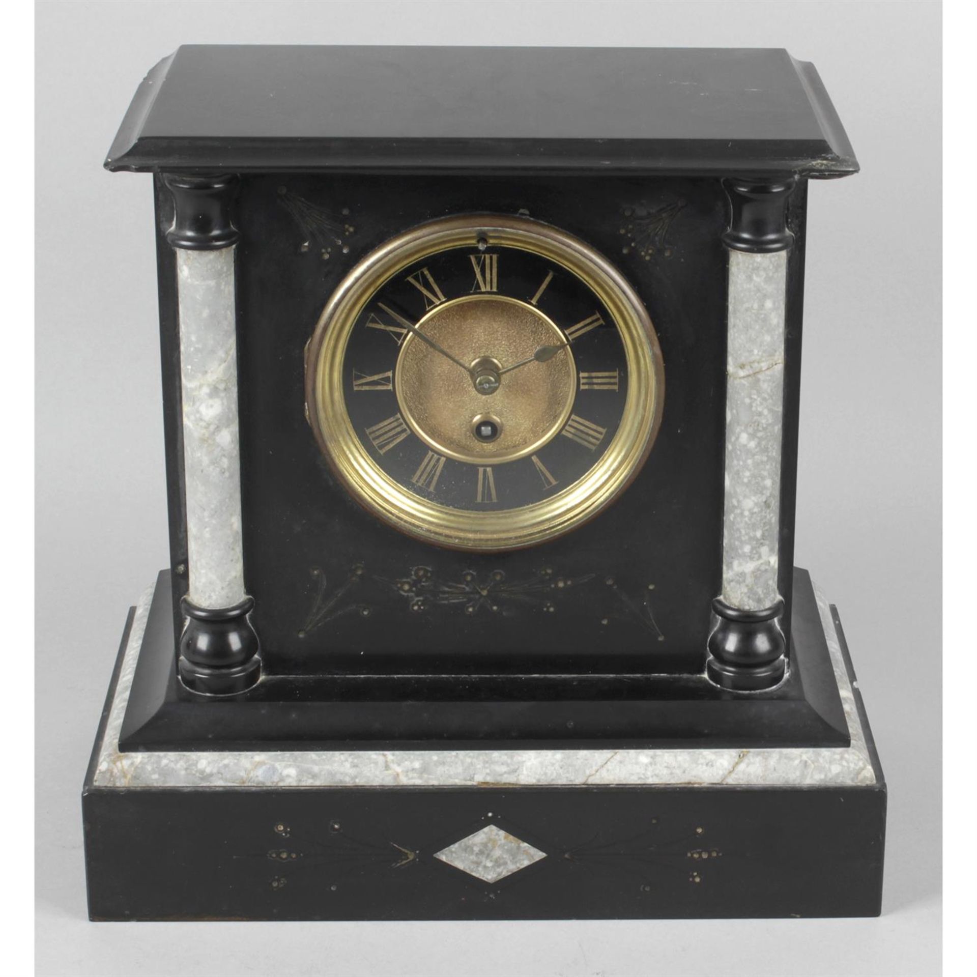 A Victorian black slate and marble mantel clock