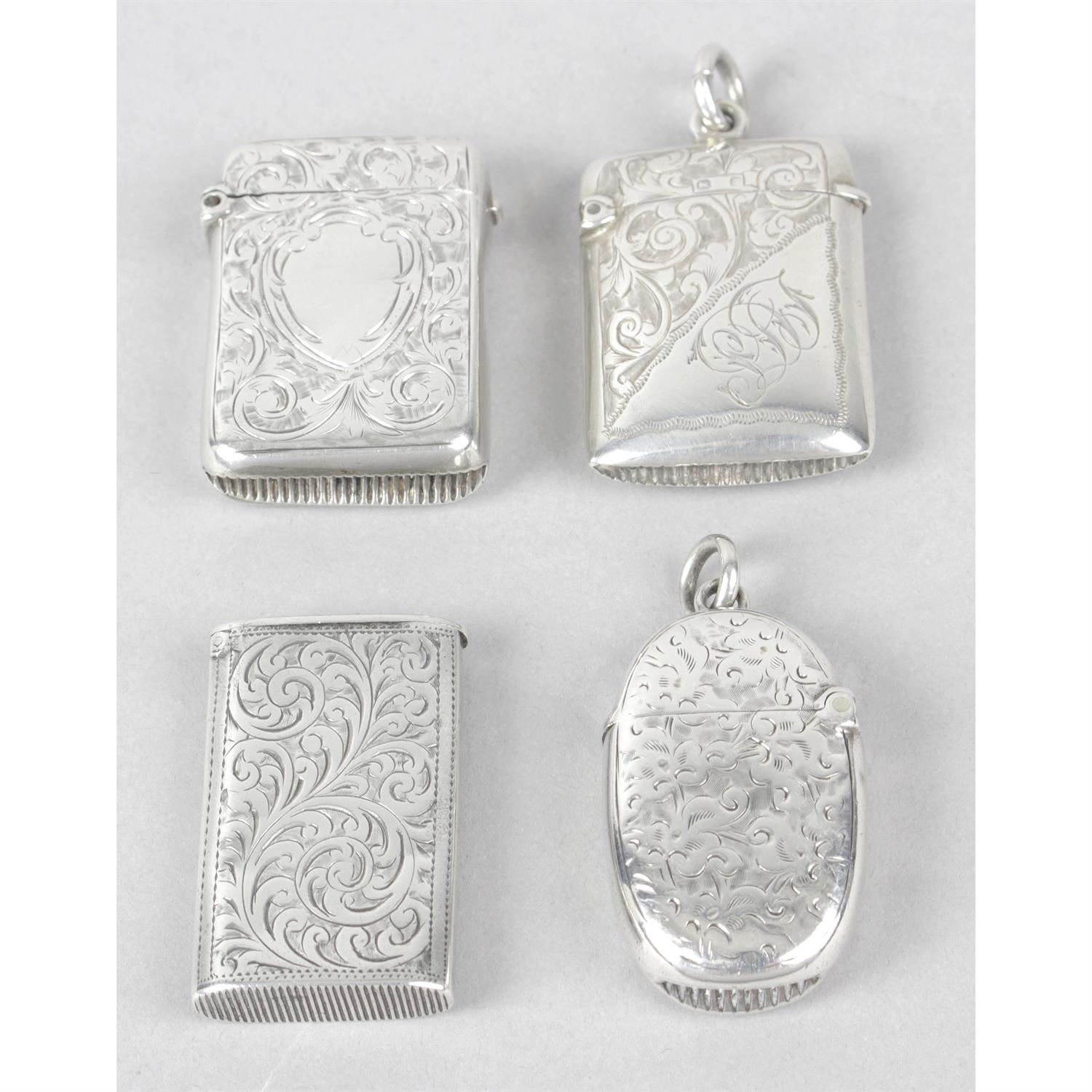 Four small late Victorian silver vesta cases, all foliate engraved. (4).