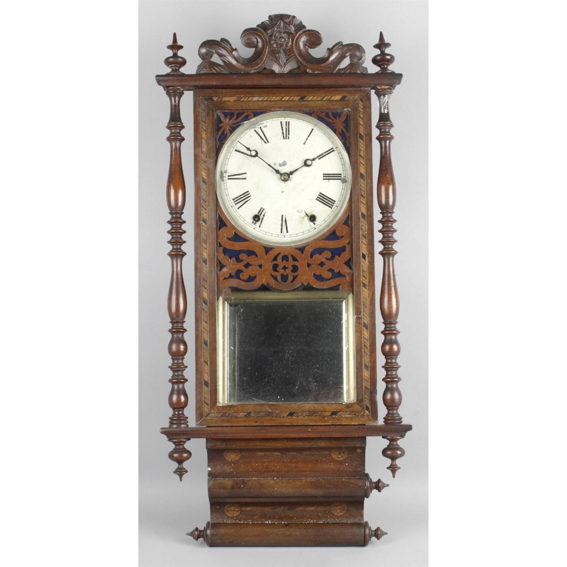 A late 19th century stained mahogany wall hanging clock.