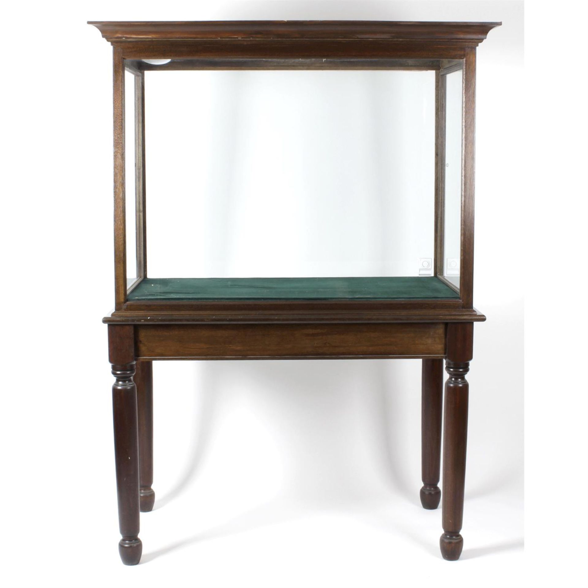 A large reproduction mahogany display cabinet.