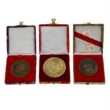 A mixed lot to include Chinese tourist medals, British commemorative crowns, etc. (lot).