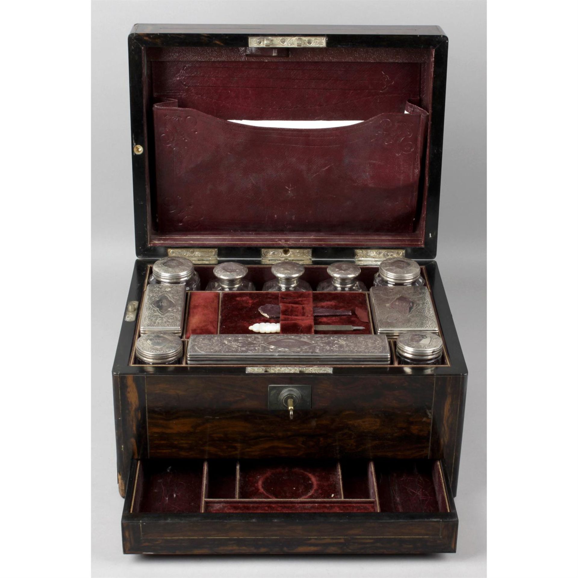 A Victorian coromandal travelling dressing table box.