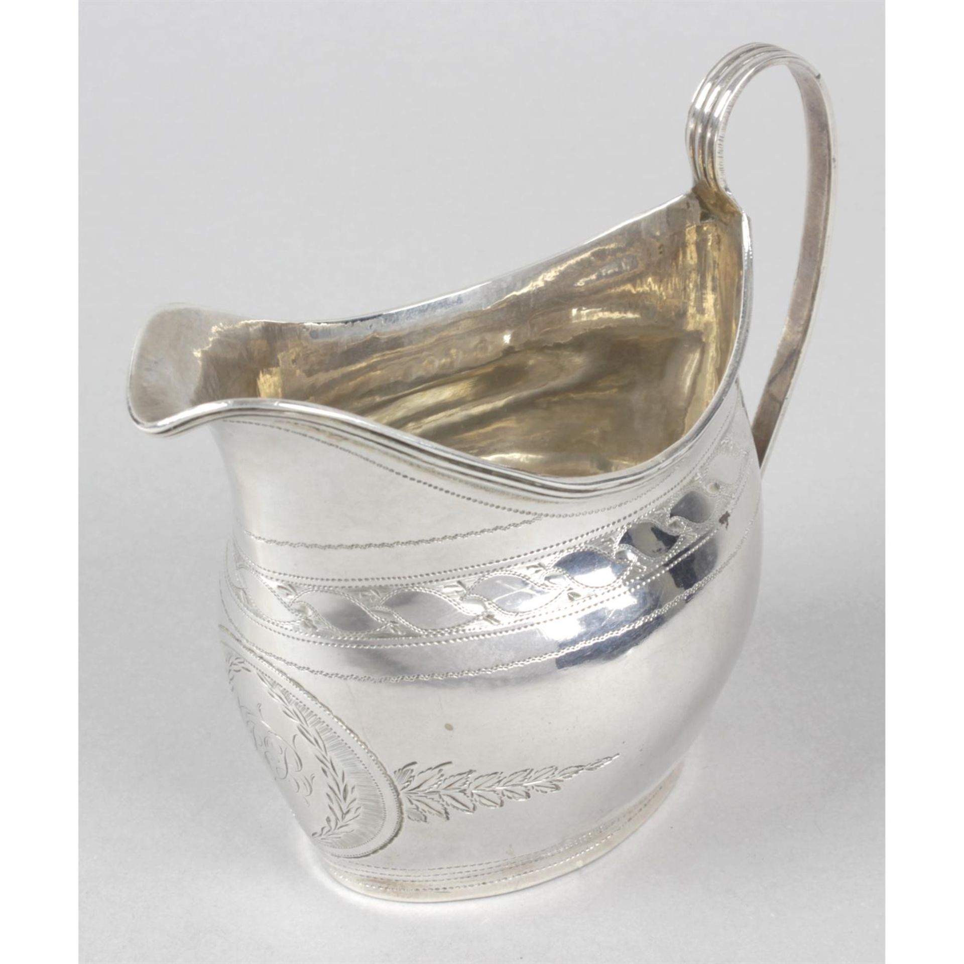 A late George III silver cream jug.