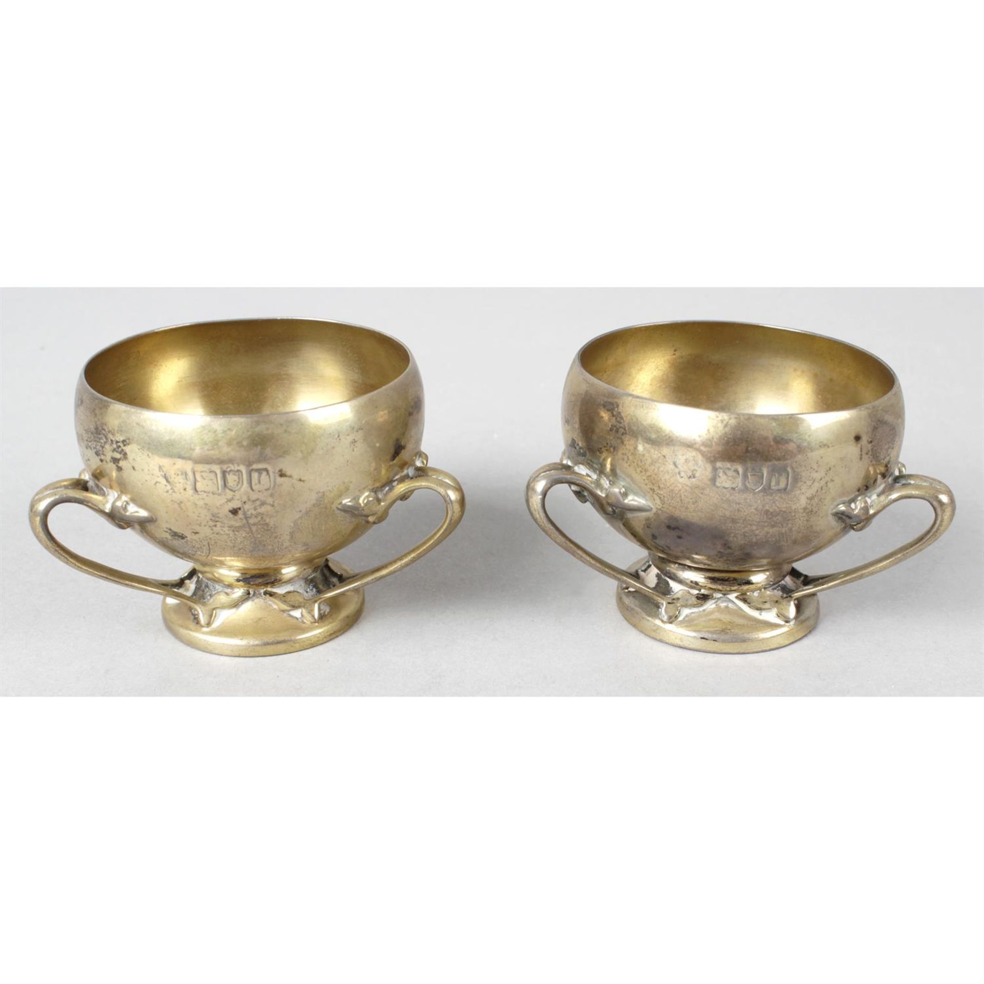 A pair of Art Nouveau style silver-gilt salt cellars.