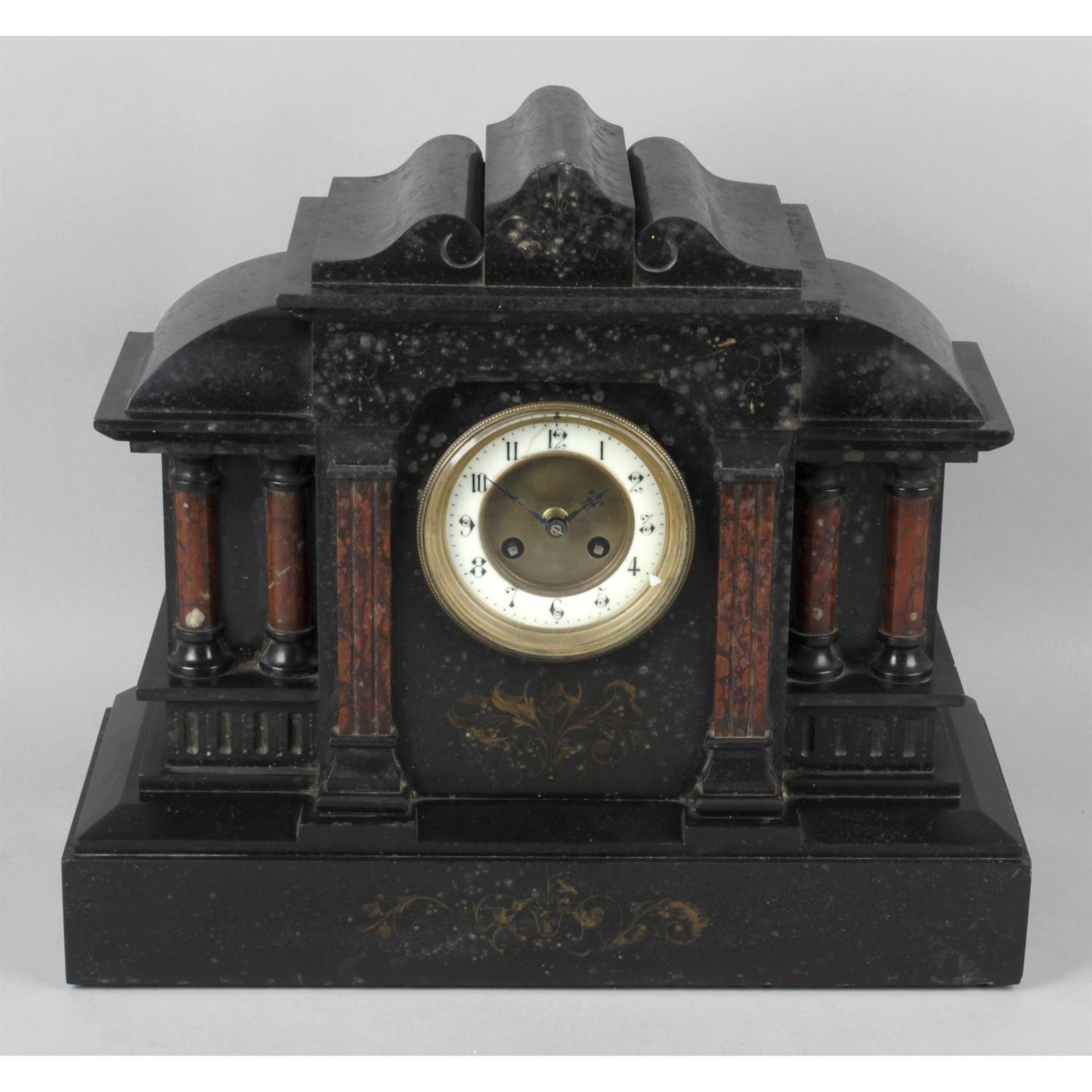 A Victorian black slate and rouge marble mantel clock.
