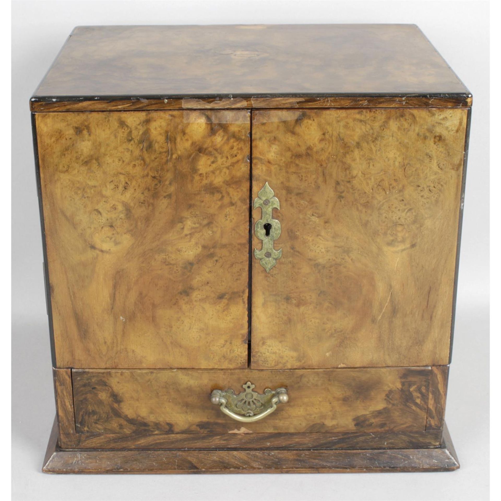 An early 20th century walnut smokers cabinet.