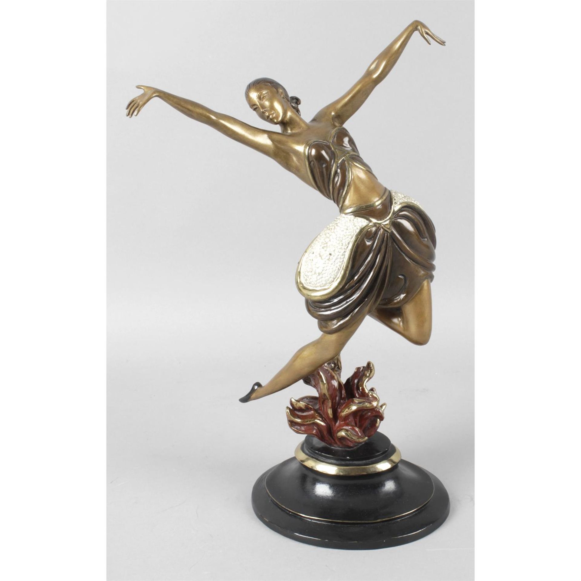 A cold painted bronze modelled as a dancer.