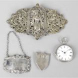 A collection of assorted items to include an Indian pierced metal belt buckle, silver fob watch and