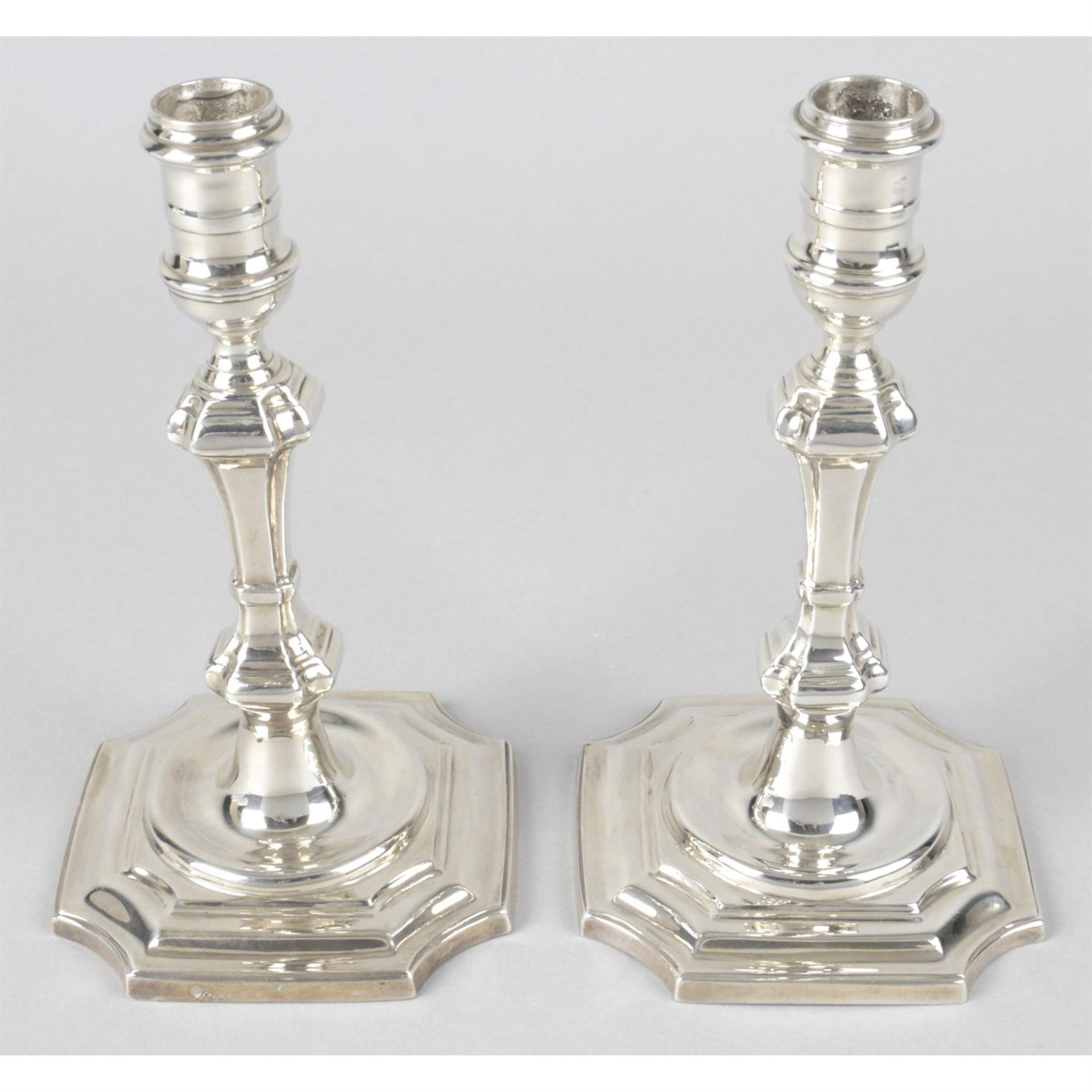 A pair of modern silver reproduction candlesticks.