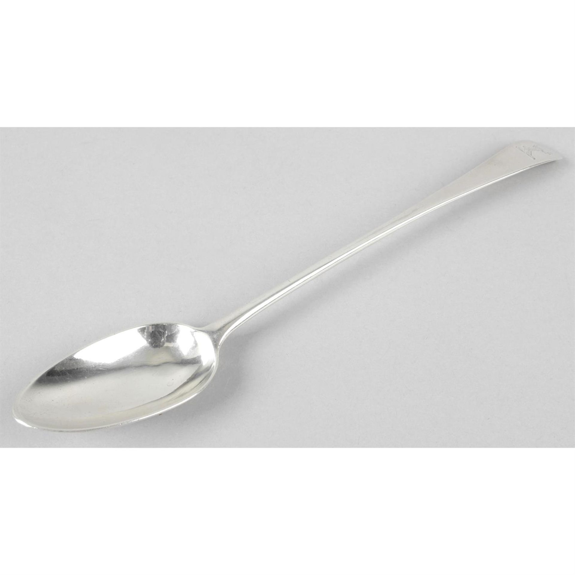A George III silver serving or basting spoon.
